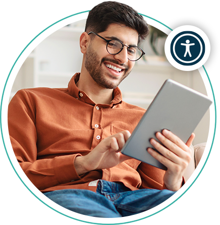 A man wearing glasses using a tablet