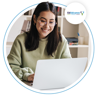 Image of a young woman with glasses on her laptop