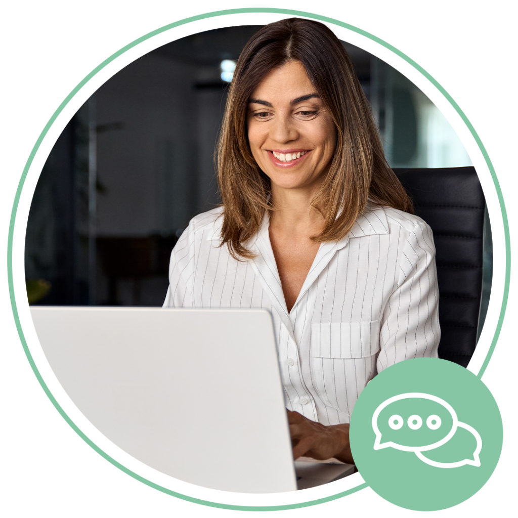 woman sitting at laptop smiling