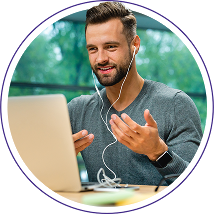 man working on a laptop with headphones