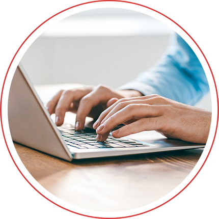 close up shot of someone typing on a laptop