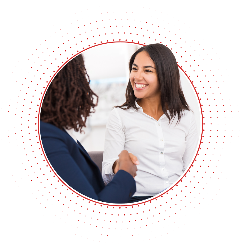 Two women shaking hands joining the Recite Me Partner Program