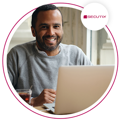 Man at laptop smiling