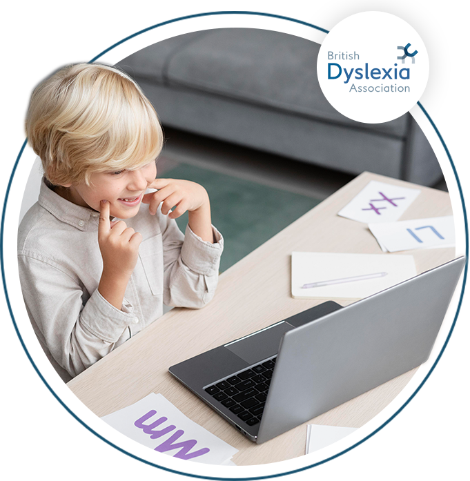 Youn child working on letters on the laptop