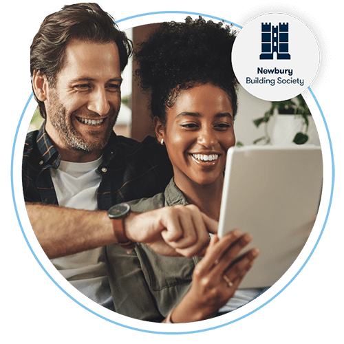 Man and woman using a tablet and smiling