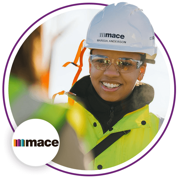 Lady in helmet, glasses and a highvis