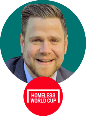 Matthew Williams' headshot, smiling toward the camera with the Homeless World Cup logo underneath